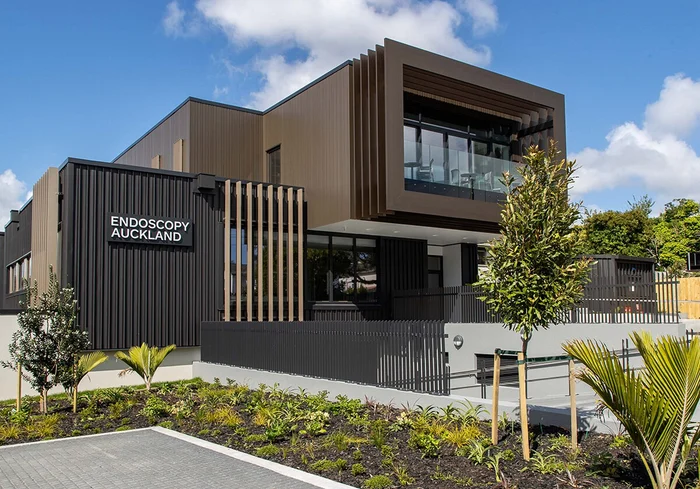 Street-facing Endoscopy Auckland building at 22 Kipling Avenue, with the practice sign on its dark facade.